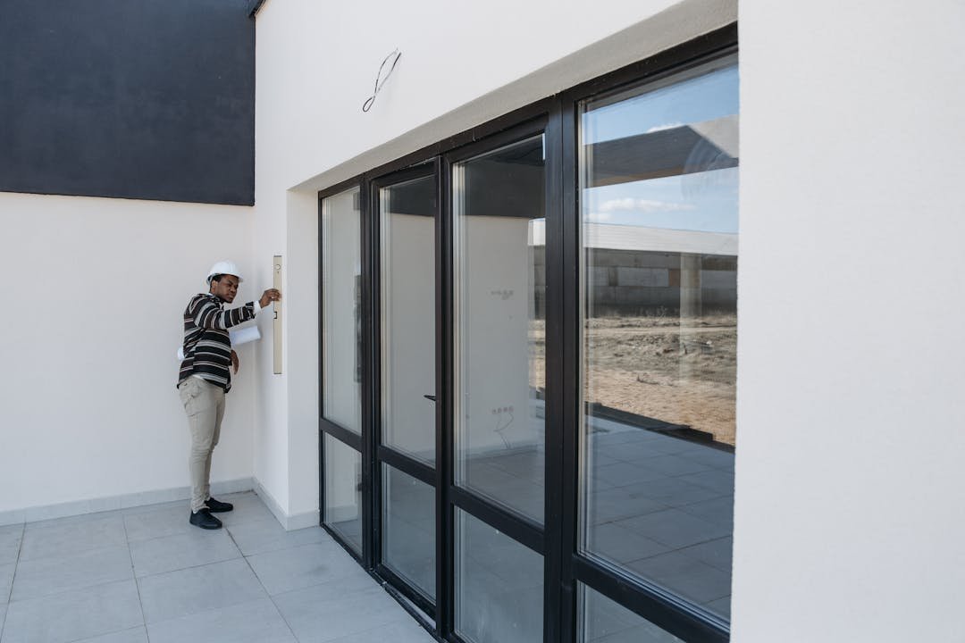 Inspector checking wall